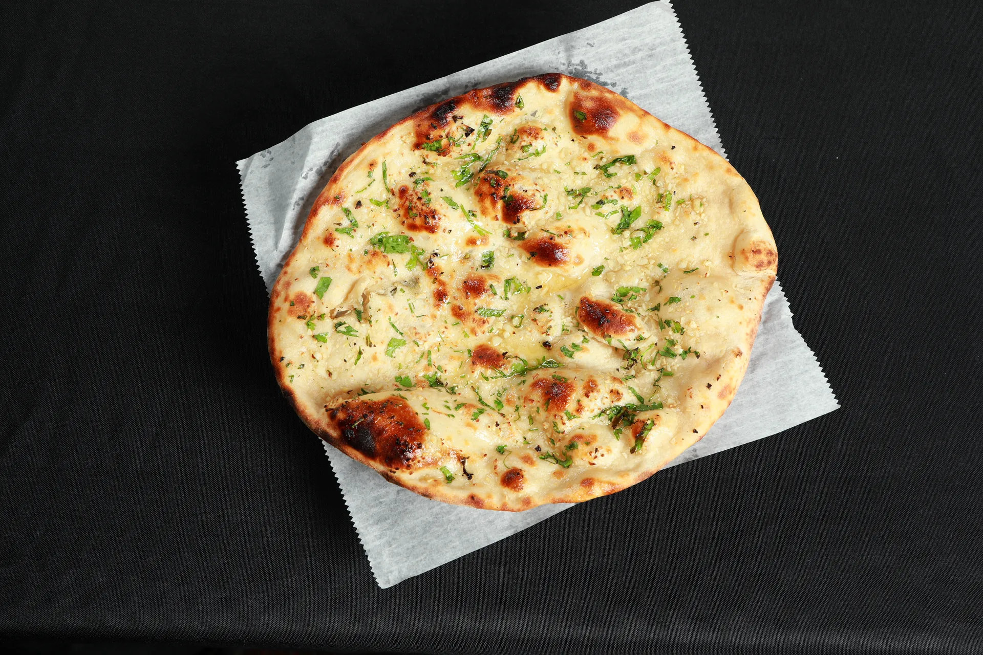 Garlic naan fresh from the tandoor