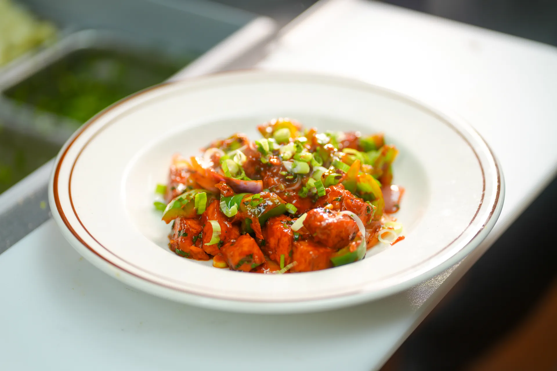 Paneer chilli tossed with peppers
