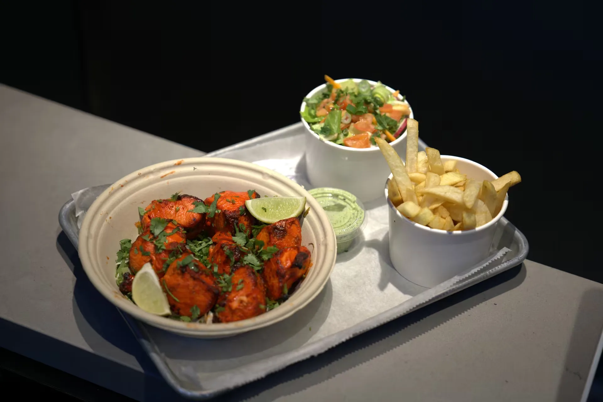 Tandoori chicken with salad and fries